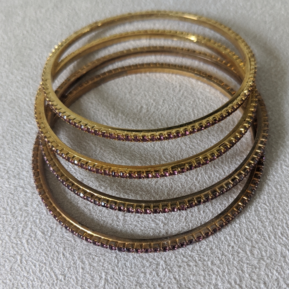 Gold bangle bracelet set with pink rhinestone gems